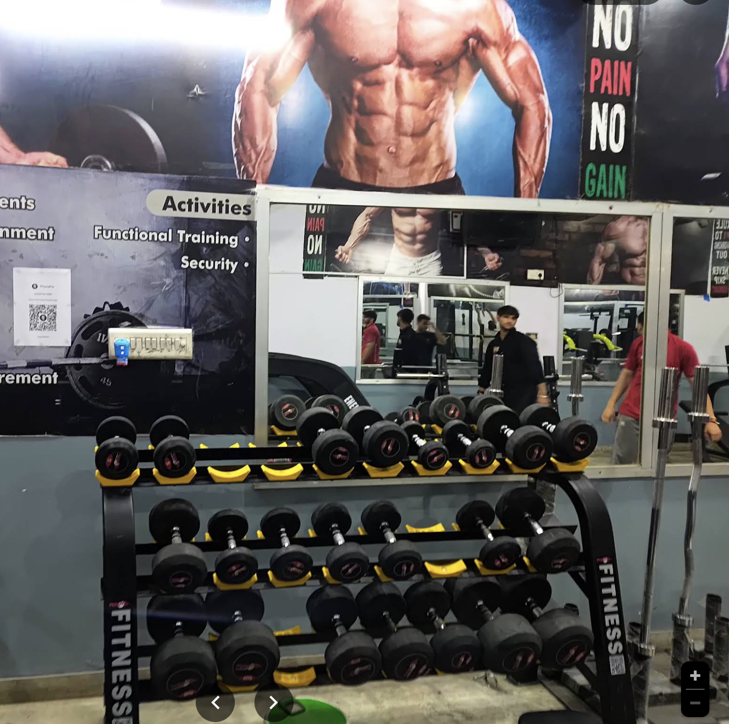 Hostel gym dumbbell and mirror section